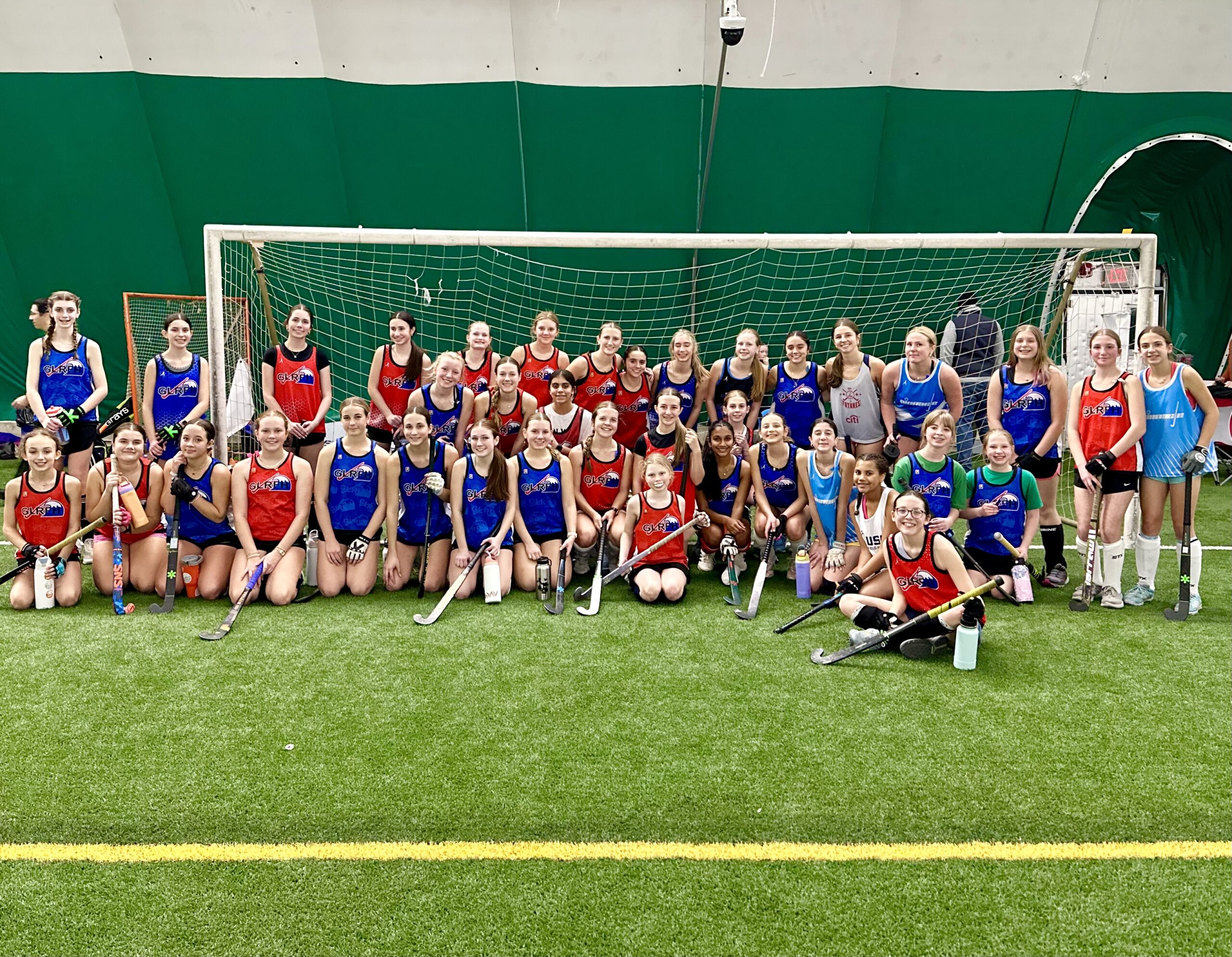 group of youth field hockey players from the midwest