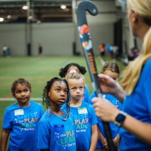 Youth players at a Great Lakes Regional field hockey program