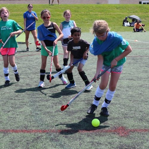 athletes participating in a summer youth field hockey clinic hosted by glrfh