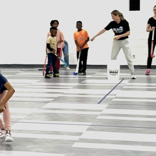 group of co-ed youth field hockey players during a glrfh event in Detroit